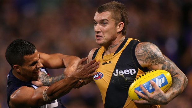 Dustin Martin faces off against Fremantle's Danyle Pearce earlier this year.