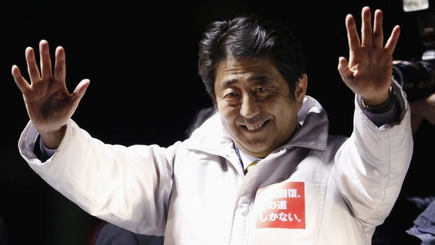 Japanese Prime Minister Shinzo Abe waves to voters at a campaign rally on Friday.