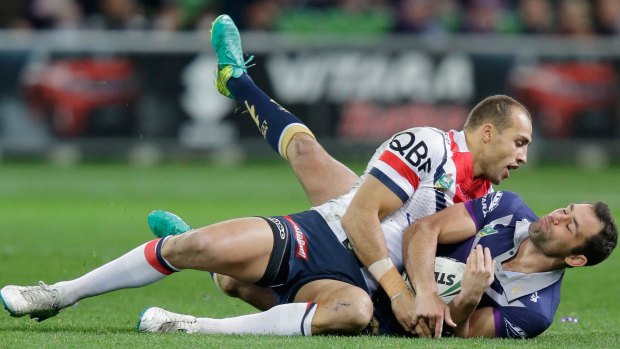 Cameron Smith is tackled at AAMI Park.