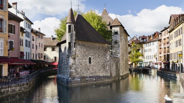 View of the former prison surrounded by canals in Annecy, France.