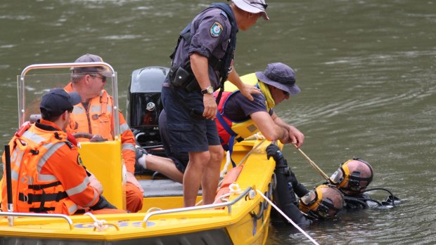 Police divers search the Murrumbidgee River in Wagga on Thursday, after Peter Abd-El-Kaddous went missing.