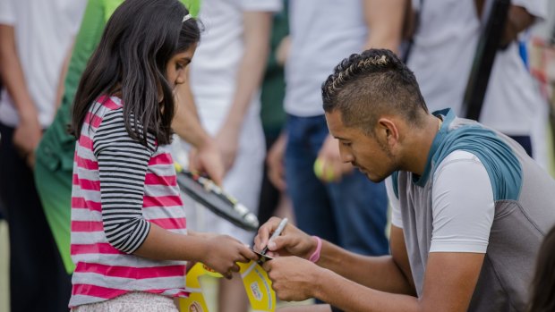 Instead of playing Davis Cup, Nick Kyrgios had a hit with kids at the Weston Creek Tennis Club on Saturday as part of their open day.