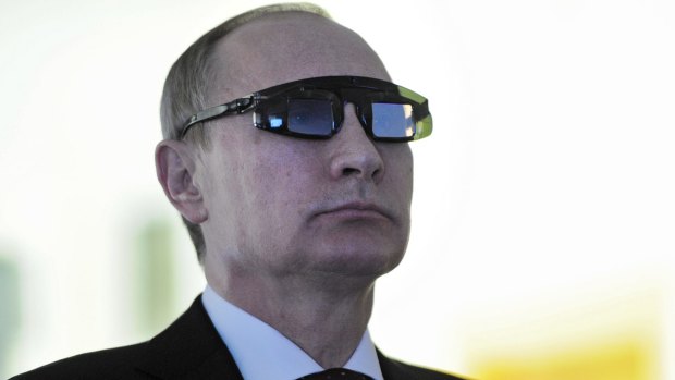 Russian President Vladimir Putin wears special glasses during a January visit to a research facility in St Petersburg