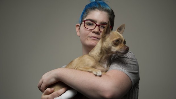 Isabelle Goldstraw with her dog Flea after an attack by two dogs killed her other pet chihuahua in her living room and left her with an injured finger. 