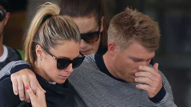 David Warner, accompanied by his wife Candice Falzon cries as he leaves the hospital on Thursday. 