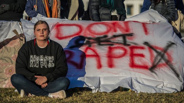 Female students protested in front of federal Parliament earlier this month urging a tougher response to sexual assault from universities and the government.