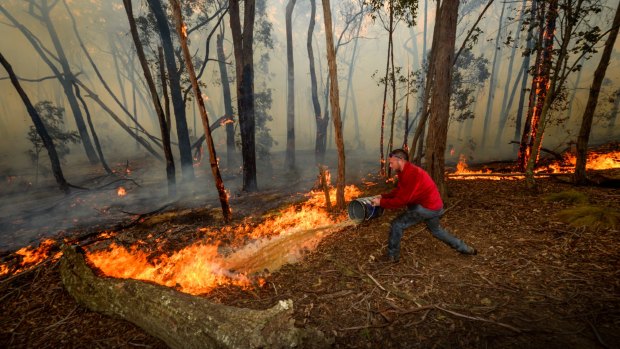 Adam Watkin fighting to save his home near Three Chain Road.