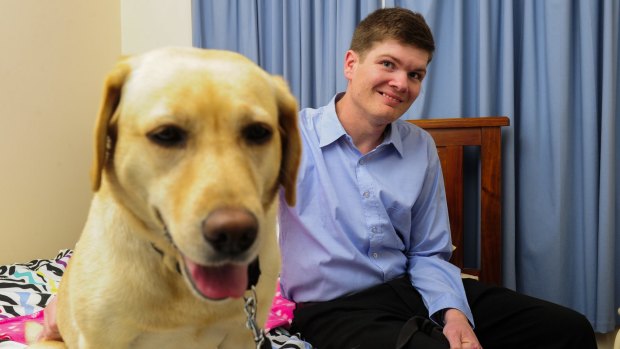 Ronnie Lawrence with his assistance dog Sandy, which he received through the NDIS.