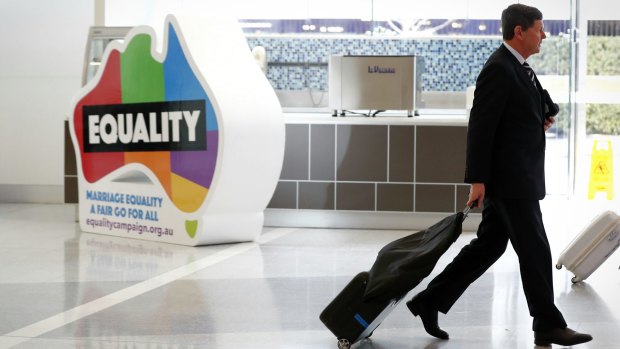 Liberal MP Kevin Andrews arrives at Canberra Airport for the meeting.