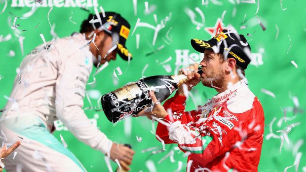 Party time: Sebastian Vettel celebrates on the podium.