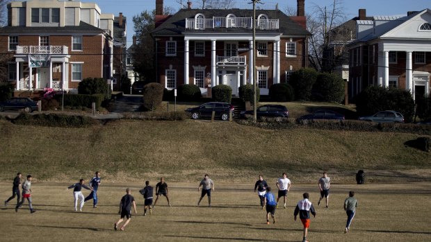 Students play rugby on the Madison Bowl field of the University of Virginia campus next to fraternity houses, in Charlottesville.
