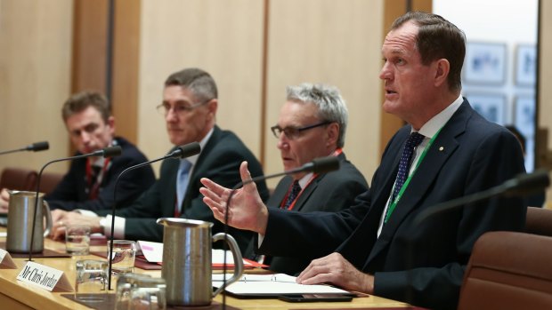From left: The ATO's Jeremy Hirschhorn, Mark Konza, Michael Cranston and Chris Jordan appear before one of their scrutineers, the economics references committee, at Parliament House in Canberra. 