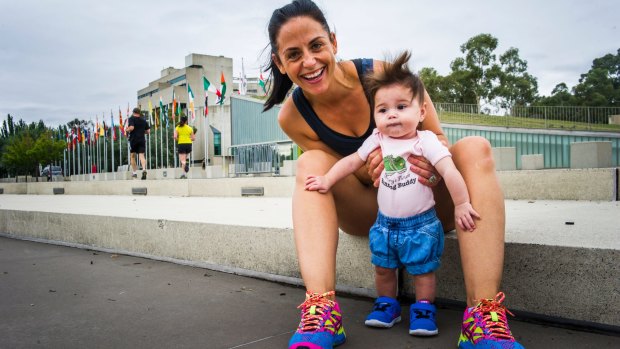 Former Canberran Kristine Elliot will run the 10km in the Australian Running Festival and try to beat her pre-baby time. Pictured with 6mth old daughter Olive. 
