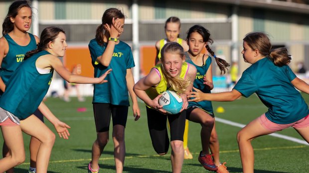 VIVA7s: Young girls take part in a game of non-contact rugby.