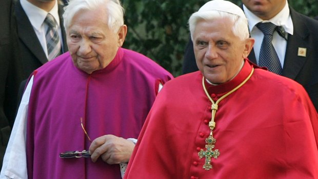 Pope Benedict XVI, right, walks with his brother priest Georg Ratzinger in Regensburg, southern Germany. 