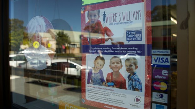 A poster in a Laurieton shop window about missing toddler William Tyrrell.