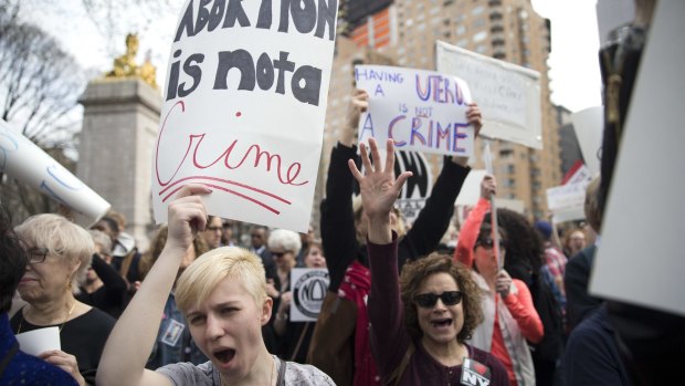 Women participate in a rally in New York to condemn Donald Trump's remarks about women and abortion.