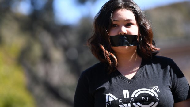 A student of the Australian National University participates in a protest after the release of the national student survey on sexual assault and sexual harassment in Canberra on Tuesday.