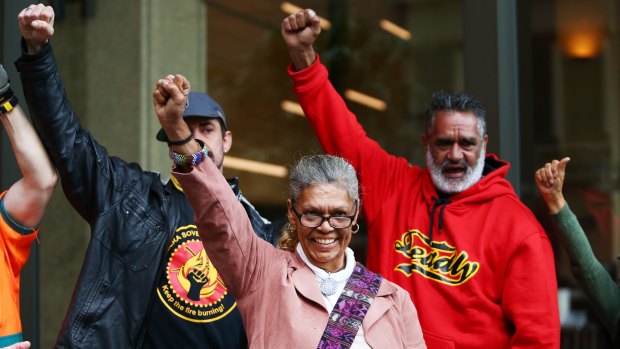 Aboriginal rights activist Jenny Munro smiles as she arrives at the Supreme Court on Thursday.