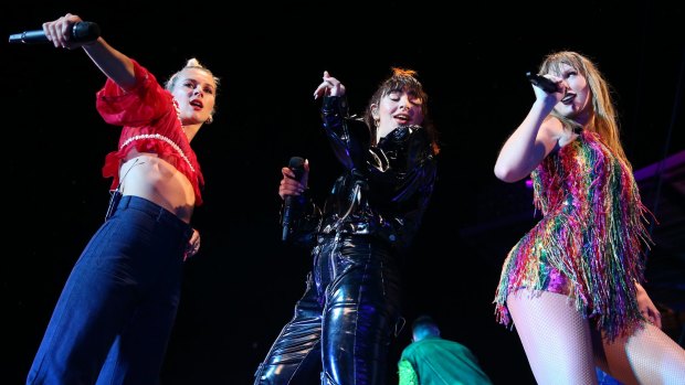 Taylor Swift (right) performs with Georgia Nott of Broods (left) and Charli XCX (middle) in Auckland. 