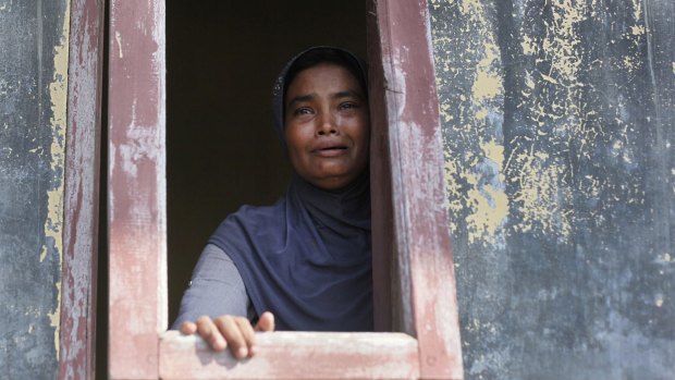 A Rohingya woman weeps  at a temporary shelter in Lapang, Aceh province, Indonesia,  last May.