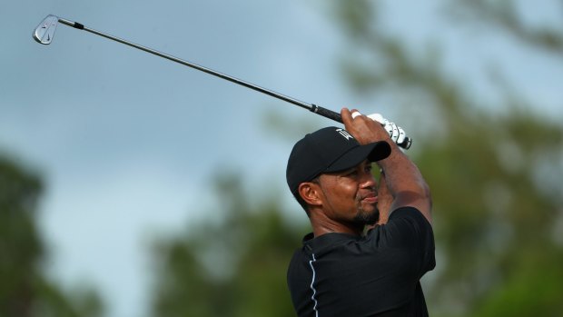 Tiger Woods in action in the Bahamas... the golfing great is no stranger to Australian shores.