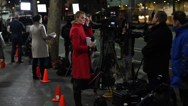 Media wait for Cardinal George Pell to arrive at Melbourne Magistrates Court. 