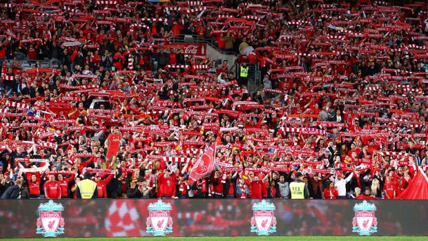 Sea of red: Liverpool FC fans sing before kick-off.