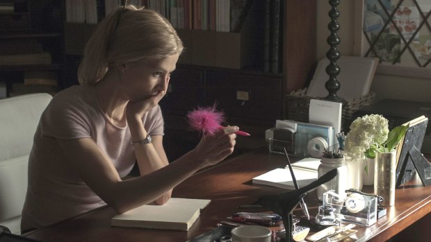 Rosamund Pike as Amy considers one of her diary entries in Gone Girl. 