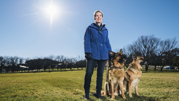 Sandra Hassett with her dogs in the new Hassett Park in Campbell. The park has been named after her father, General Sir Francis Hassett.