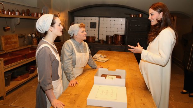 Catherine, Duchess of Cambridge chats to actresses Sophie McShera and Lesley Nicol during an official visit to the set of Downton Abbey at Ealing Studios last year.