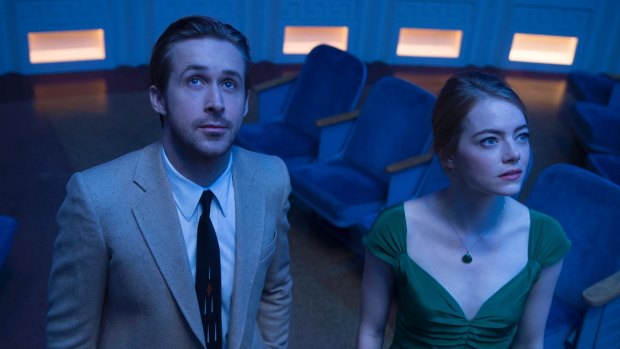 Surprise negativity: Ryan Gosling and Emma Stone play idealists struggling against reality in <i>La La Land</i>.
