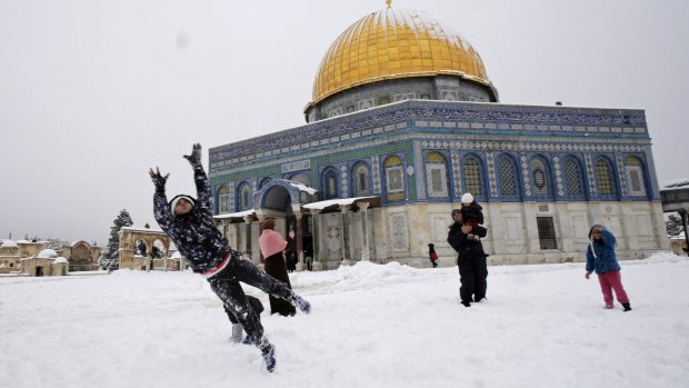 Snowball fights in front of the Dome of the Rock in Jerusalem's Old City.