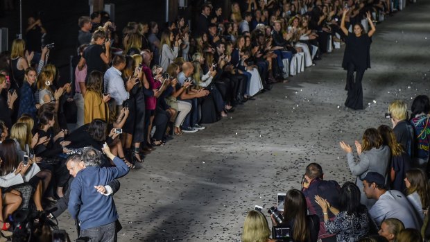 Close call: Security stopped a man from running onto the catwalk as designer Kym Ellery took a bow at the end of the opening night's show.