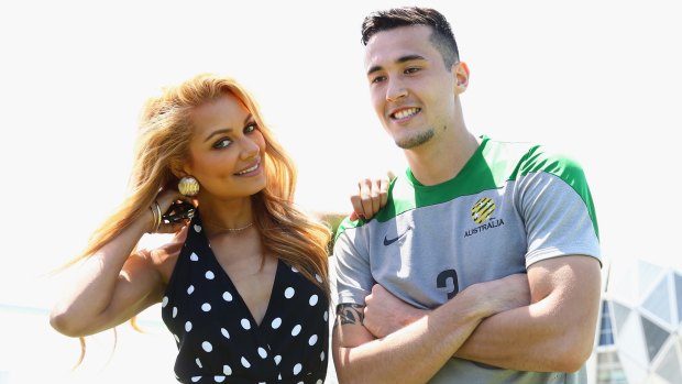 Australian singer and DJ Havana Brown poses with Socceroo Jason Davidson after a Socceroos training session at Collingwood training ground on Sunday.