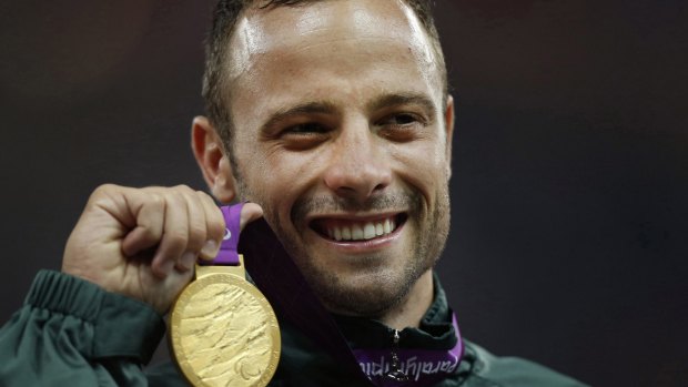 Oscar Pistorius poses with his medal after winning the men's 400 metres T44 category final during the athletics competition at the 2012 Paralympics, in London. 
