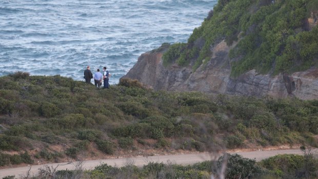 Police look for evidence after a woman's body was found.