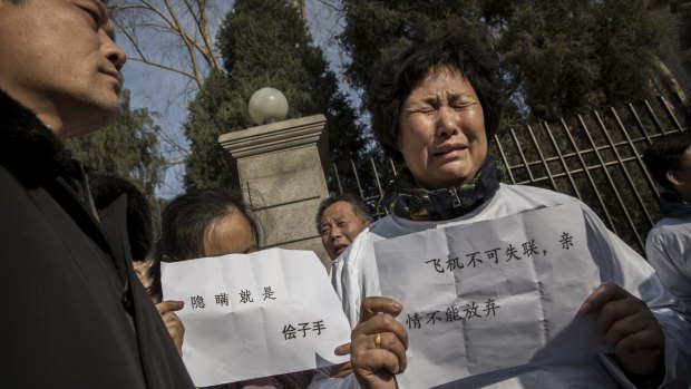 A relative of a passenger on MH370 at a protest outside the Malaysian Embassy in Beijing.