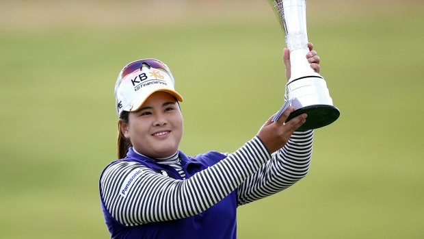Inbee Park of South Korea poses with the trophy.