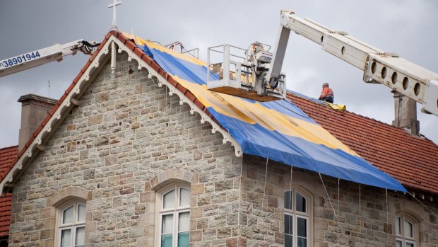 St Josephs College on Gregory Tce suffered heavy hail damage to its tiled roofs.