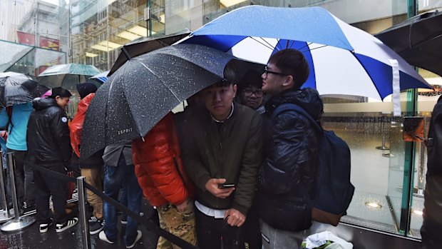 The keenest fans braved a very cold and wet morning on George Street.