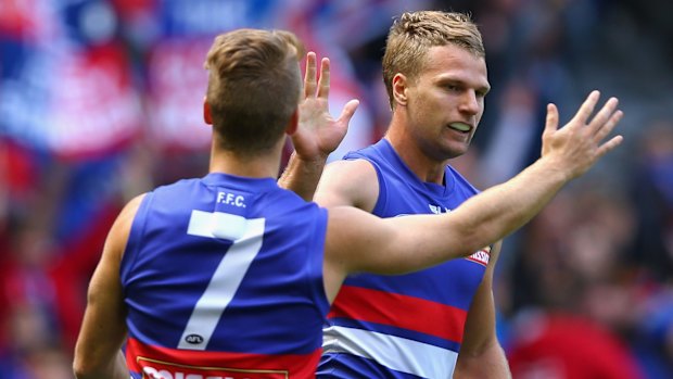 Jake Stringer is congratulated by Lachie Hunter 