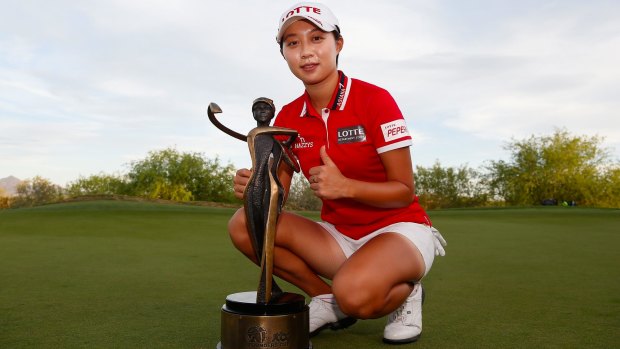 Hyo Joo Kim poses with the LPGA Founders Cup trophy.
