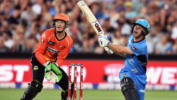 Man of the match Travis Head of the Adelaide Strikers hits a six.
