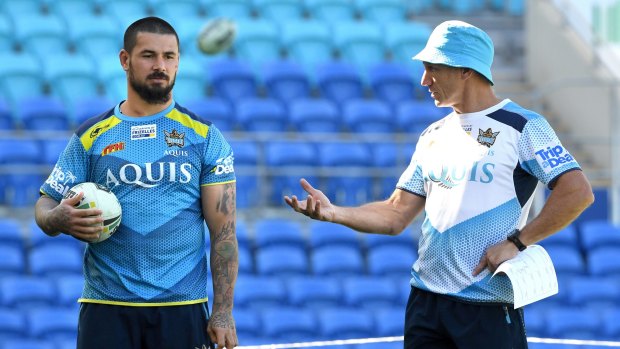 Fighting back: Titans hooker Nathan Peats with coach Neil Henry at trainning.