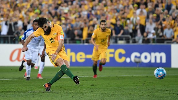 Mile Jedinak scores from the penalty spot the first time around.