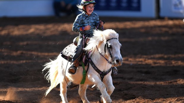 Seven-year-old Dekota Caban and her Shetland pony, Biscuit, at the Mt Isa Rodeo. 