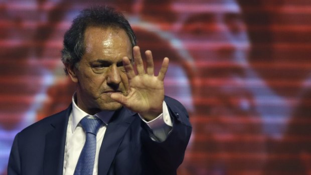 Ruling party presidential candidate and Buenos Aires Governor Daniel Scioli, greets supporters in Buenos Aires on Sunday.