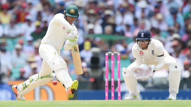 Footwork: Usman Khawaja gets down the track to a spinning ball.
