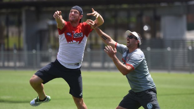 All-rounder: Sam Groth has a kickaround with the Swans at training. 
